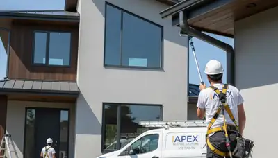 Professional gutter painting on a Chandler AZ home exterior by expert house painters